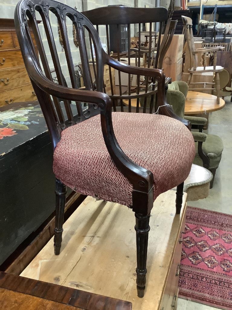 A Hepplewhite style carved mahogany open armchair, width 55cm depth 50cm height 92cm